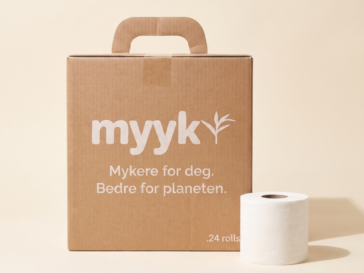 Myyk-eske i brun papp med en rull bambus toalettpapir ved siden av